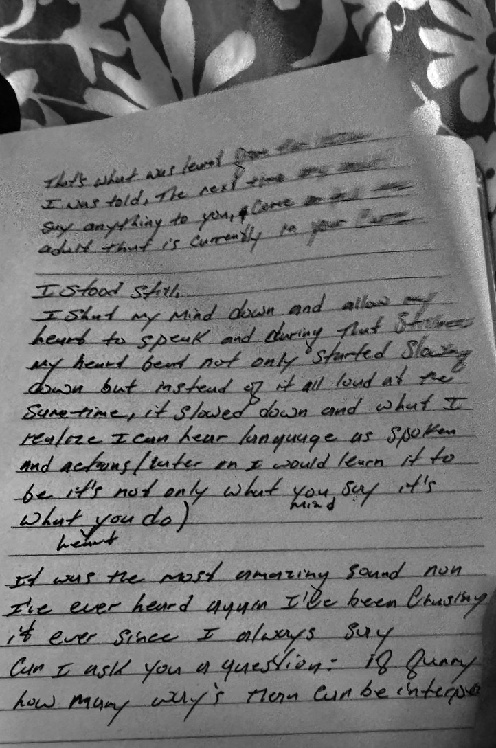 Black-and-white photograph of a handwritten notebook page