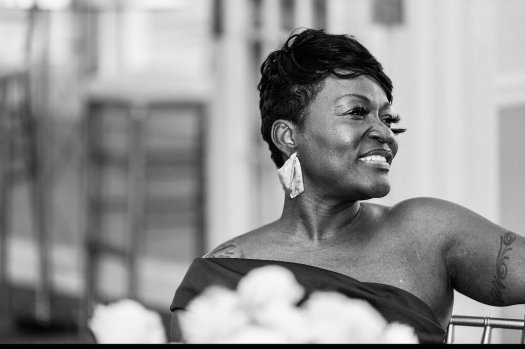 Black-and-white portrait of Florence Knights smiling